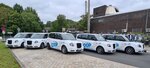 Mehrere Loop-Fahrzeuge auf einem Parkplatz